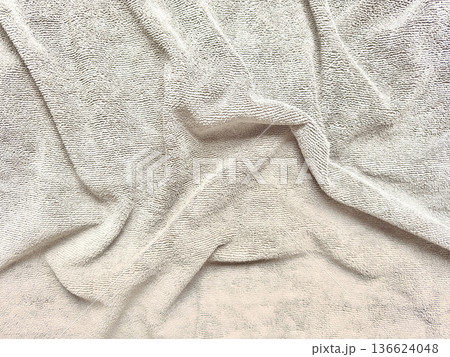 soft beige terry towel elegantly folded on pastel blue background with ample copy space for spa banner or wellness wallpaper soft beige terry towel elegantly folded on pastel blue background with ample copy space for spa banner or wellness wallpaper 136624048