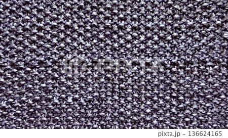 closeup gray knitted texture intricate stitch pattern cozy wool fabric seamless background for design wallpaper or fashion illustration 136624165