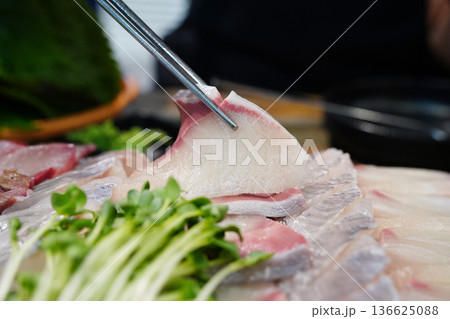 Fresh raw yellowtail sashimi fish slices on a plate, seasonal Korean winter seafood delicacy 136625088
