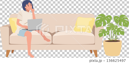 home office lifestyle female freelancer working online on couch with indoor plant home office lifestyle female freelancer working online on couch with indoor plant 136625497