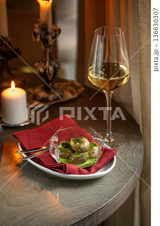 Escargot snails with garlic herb butter 136630307