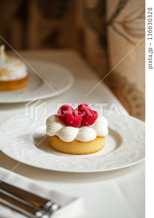 Raspberry dessert tart with whipped cream Raspberry dessert tart with whipped cream 136630328