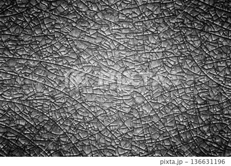 Black metal background with abstract cracks. Black metal background with abstract cracks. 136631196