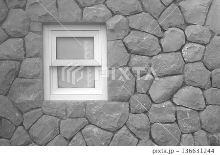 Beautiful stone walls modern windows decorate the exterior 136631244