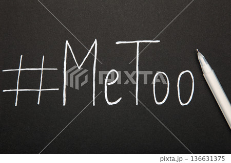 Hashtag METOO inscription white pen on black background Hashtag METOO inscription white pen on black background 136631375