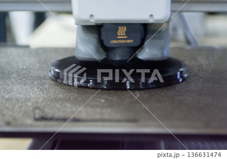 3D printer. 3D printer printing object close-up. 3D printer printing model black color. Working 3D printer. Concept printing technology. New modern additive progressive technology. FDM technologies 136631474