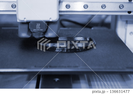 3D printer. 3D printer printing object close-up. 3D printer printing model black color. Working 3D printer. Concept printing technology. New modern additive progressive technology. FDM technologies 136631477