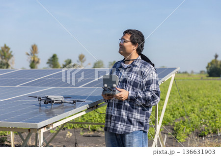 Modern Technologies in Agriculture. Farmer with drone on the farm field. Smart farming and precision agriculture. Modern Technologies in Agriculture. Farmer with drone on the farm field. Smart farming and precision agriculture. 136631903