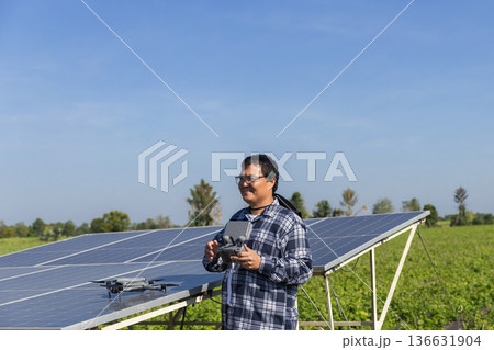 Modern Technologies in Agriculture. Farmer with drone on the farm field. Smart farming and precision agriculture. Modern Technologies in Agriculture. Farmer with drone on the farm field. Smart farming and precision agriculture. 136631904