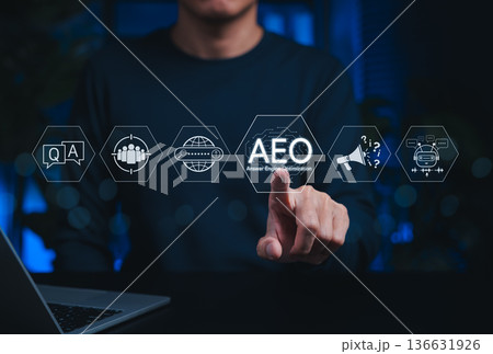 Answer engine optimization (AEO) strategy concept. Person interacts with AEO icons, AI, chatbot, search, Q and A, FAQ, representing modern digital marketing for online visibility, user engagement, 136631926