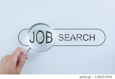 Job Search Concept. Magnifying glass focusing on word JOB in search bar, representing career exploration, recruitment, employment opportunities, hiring, online job hunting, finding new position, 136631946
