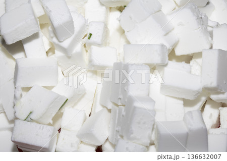 Close up white cube vegan feta cheese sliced food Close up white cube vegan feta cheese sliced food 136632007