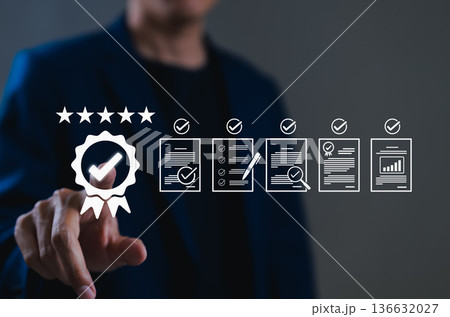 Quality assurance and certification compliance concept. Businessman touching digital interface certification badge, quality assurance, standards compliance, audit process, and performance excellence. Quality assurance and certification compliance concept. Businessman touching digital interface certification badge, quality assurance, standards compliance, audit process, and performance excellence. 136632027