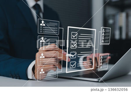 Recruitment process concept, HR manager analyzing digital candidate profiles and checklists on virtual interface, selecting qualified applicants for job positions using modern hiring technology. Recruitment process concept, HR manager analyzing digital candidate profiles and checklists on virtual interface, selecting qualified applicants for job positions using modern hiring technology. 136632056