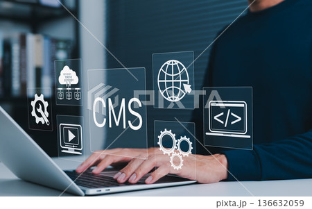 Content management system (CMS) concept. User operating website development tools on laptop, managing web content, cloud data, coding, and multimedia for digital publishing and online presence. 136632059