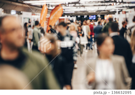Abstract blurred people at exhibition hall of expo event trade show. Business convention show or job fair. Business concept background Abstract blurred people at exhibition hall of expo event trade show. Business convention show or job fair. Business concept background 136632095