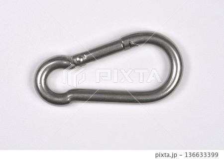 Stainless steel carabiner clip on white background 136633399