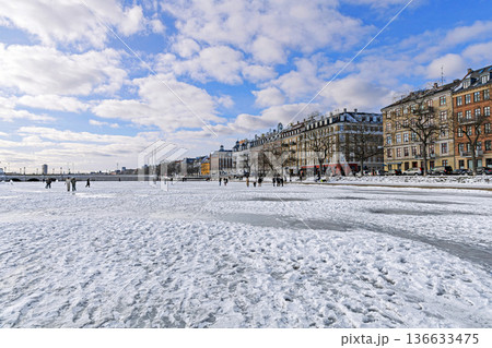 Frozen lake with people walking on ice. Copenhagen, Denmark Frozen lake with people walking on ice. Copenhagen, Denmark 136633475