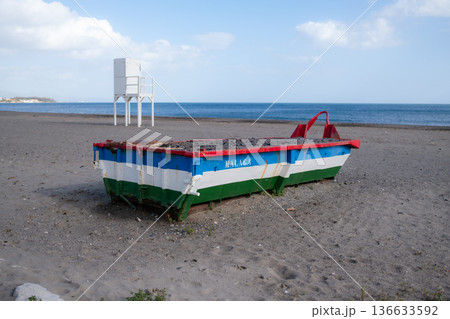 Colorful fishing boat on Malaga beach, Spain. Mediterranean seascape with copy space 136633592