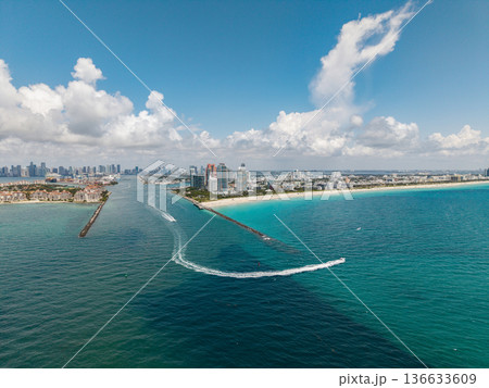Aerial view of Miami Beach city by the coast. Miami Beach skyline. Scenic Miami Beach panorama famous coastline. Drone shot of Miami Beach above the shore. 136633609
