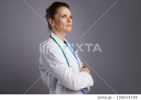 Ambitious Female Doctor Looking Up - Healthcare Vision Ambitious Female Doctor Looking Up - Healthcare Vision 136634599