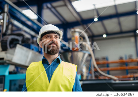 A portrait of project manager or engineer a factory, working. 136634867
