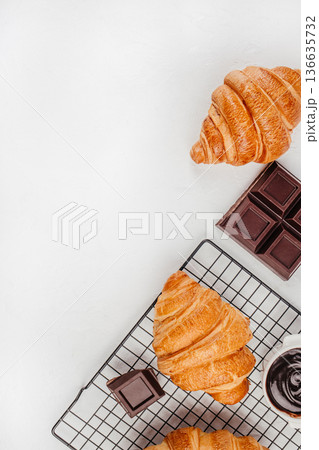 Croissant and chocolate flat lay on white banner background Croissant and chocolate flat lay on white banner background 136635732