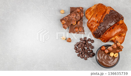 Chocolate croissant with hazelnut spread and chocolate chips banner 136635739