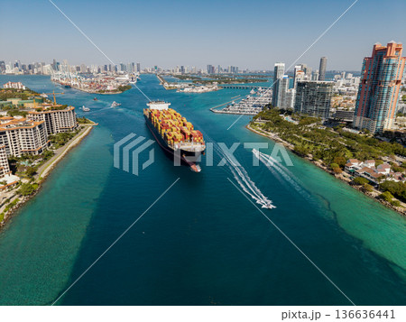 Freight container loaded on cargo vessel. Aerial ship with container. Cargo business. Container ship. Shipping logistics. Commercial shipping. Cargo ship in sea, aerial view. Cargo ship deck Freight container loaded on cargo vessel. Aerial ship with container. Cargo business. Container ship. Shipping logistics. Commercial shipping. Cargo ship in sea, aerial view. Cargo ship deck 136636441