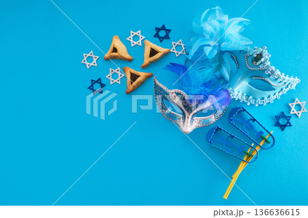 Purim holiday attributes on blue background with copy space Purim holiday attributes on blue background with copy space 136636615