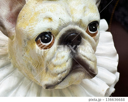 Decorative dog statue with red crown and white collar displayed as humorous art. Collection, culture, and lifestyle expressed through creativity, retail, and symbolic decoration. Decorative dog statue with red crown and white collar displayed as humorous art. Collection, culture, and lifestyle expressed through creativity, retail, and symbolic decoration. 136636688