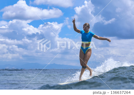 Woman Sharpens Her Longboard Talents Beneath Clear Skies And Remote Islands 136637264