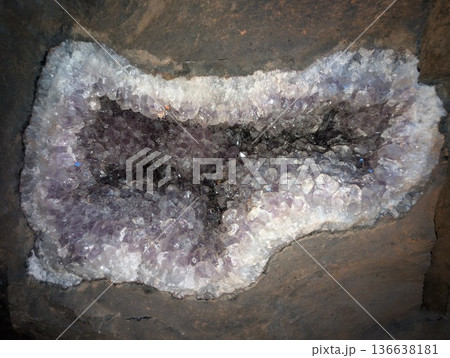 Close-up of a light purple amethyst geode embedded in basalt rock. Vanda mines in Misiones Province, Argentina Close-up of a light purple amethyst geode embedded in basalt rock. Vanda mines in Misiones Province, Argentina 136638181