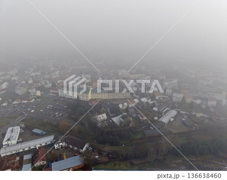 Misty Neighborhood Scenery, Serene Morning Landscape Featuring Foggy Streets And Reflective Waters 136638460