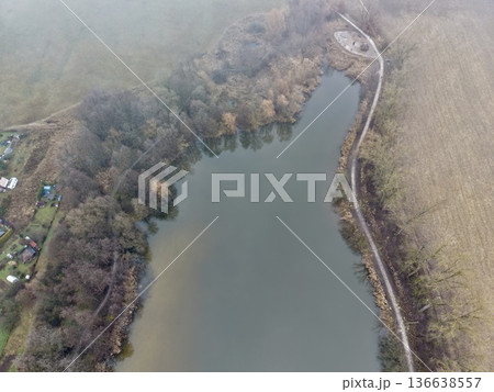 Quiet Lakeside With Vibrant Leaves, Soothing Lakeshore Sanctuary Amid Lively And Colorful Autumn Leaves 136638557