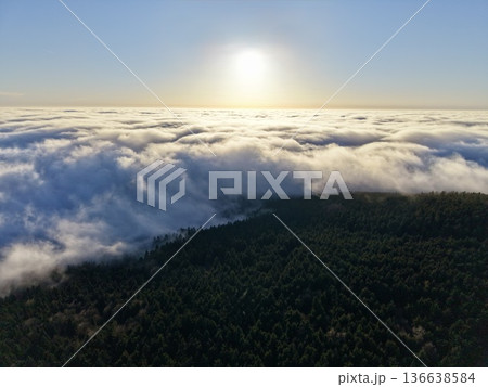 Dawn Over Mountains, Early Morning Sunlight Spreads Across Tranquil Canopy And Vast Atmospheric Expanse Dawn Over Mountains, Early Morning Sunlight Spreads Across Tranquil Canopy And Vast Atmospheric Expanse 136638584