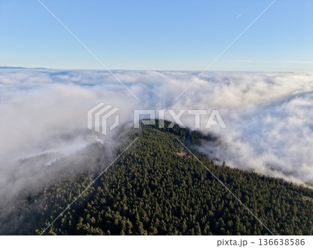 Dense Fog Engulfing Forested Ridge, Dramatic Aerial Composition With Soft Edges, Muted Tones And Secluded Mood Dense Fog Engulfing Forested Ridge, Dramatic Aerial Composition With Soft Edges, Muted Tones And Secluded Mood 136638586