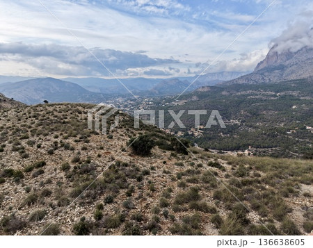 Peaceful Hilltop Overlooking Distant Valley, Tranquil Hillside Viewpoint Of Mountain Landscape And Bay Peaceful Hilltop Overlooking Distant Valley, Tranquil Hillside Viewpoint Of Mountain Landscape And Bay 136638605
