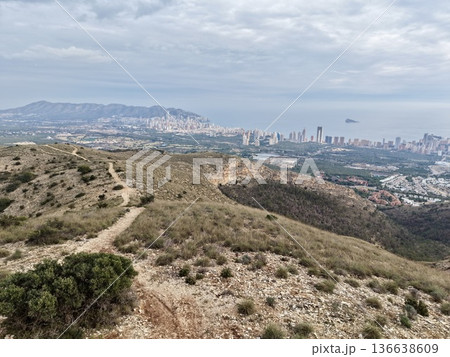 Natural Framing Of Cityscape, Mountainous Foreground Surrounds And Balances Urban Skyline Scene 136638609