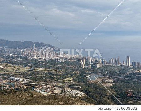 Aerial View Capturing Seaside City With Dense Skyscraper Clusters And Harbor Activities Under Cloudy Sky Aerial View Capturing Seaside City With Dense Skyscraper Clusters And Harbor Activities Under Cloudy Sky 136638632