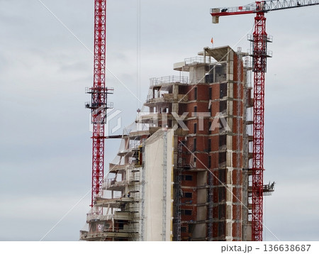 Morning Becomes Concrete And Steel, Industrial Area Awakens As Crane Raises Building Components 136638687