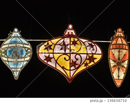 Warm Glowing Lanterns Rest Above Nostalgic Ornaments With Star And Stripe Patterns In Cozy Market Scene 136638710