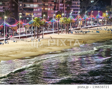 Energetic Coastal Festival Illuminated By Neon Lights And Adorned With Decorative Garlands 136638721