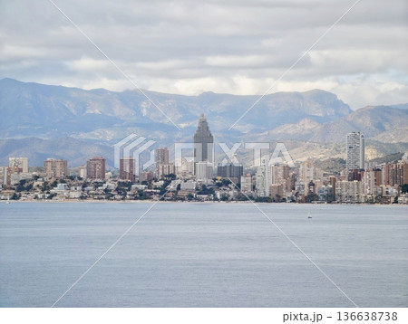 Calm Harbor With Skyscrapers Shining, Peaceful Bay Bordered By Tall Buildings And Mountains 136638738