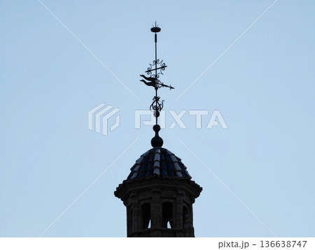 Silhouette Over Subdued Sky, Architectural Structure Featuring Crowning Iron Ornament And Simple Design 136638747