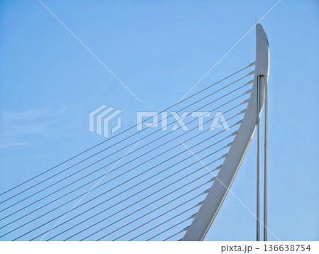 Innovative Bridge Pylon With Sleek Lines And Tensioned Supports Against Vibrant Sky Background 136638754