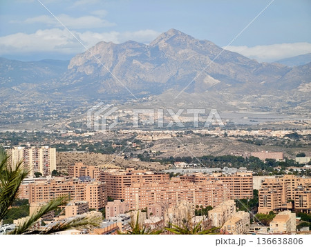 Urban Mountain Development, Vibrant Neighborhoods Stacked Along Mountain Foothills With Bustling Streets 136638806