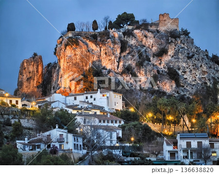 Charming Settlement Amid Rugged Cliffs, Idyllic Hamlet With Illuminated Streets And Olive Groves Charming Settlement Amid Rugged Cliffs, Idyllic Hamlet With Illuminated Streets And Olive Groves 136638820