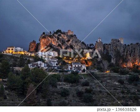 Silent Rural Hill Fortress Surrounded By Pines With Glowing Historic Structures Against Gloomy Sky 136638826
