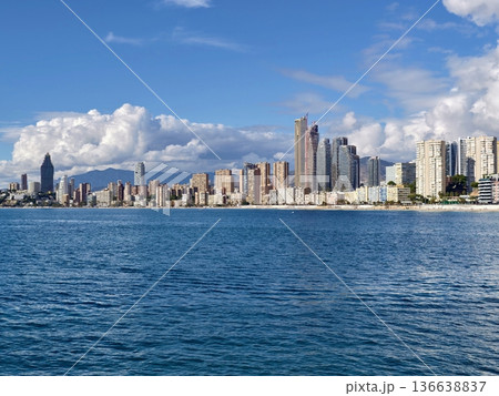 Dark Clouds Loom Over Vibrant Coastal City, Foreboding Sky Casts Shadows On Bustling City Harbor Dark Clouds Loom Over Vibrant Coastal City, Foreboding Sky Casts Shadows On Bustling City Harbor 136638837